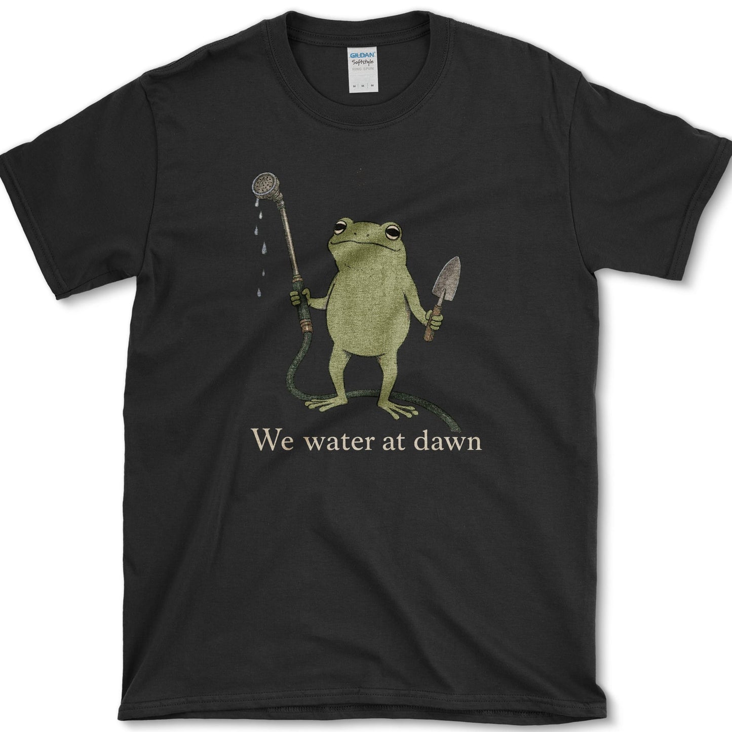 Water At Dawn artwork featuring frog and watering can on a t-shirt
