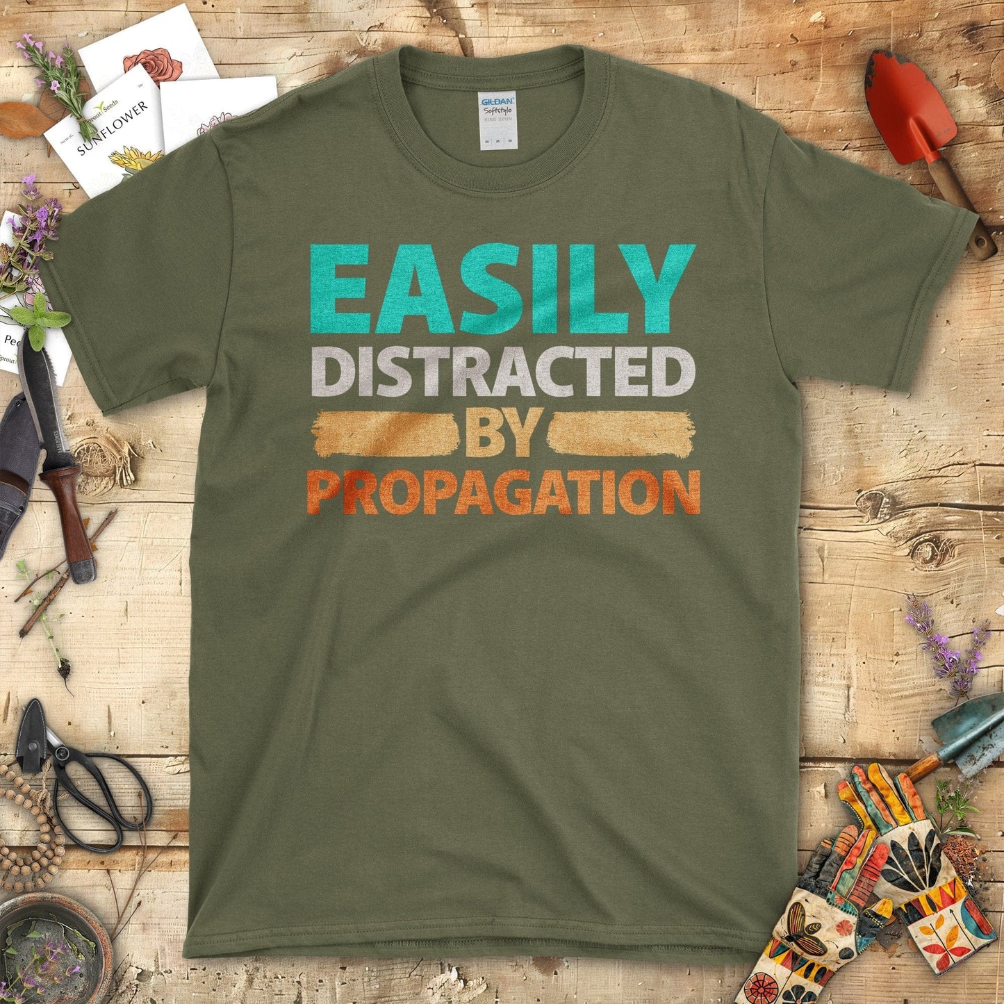 Easily Distracted By Propagation Graphic Print T-Shirt Military Green / S T-Shirt