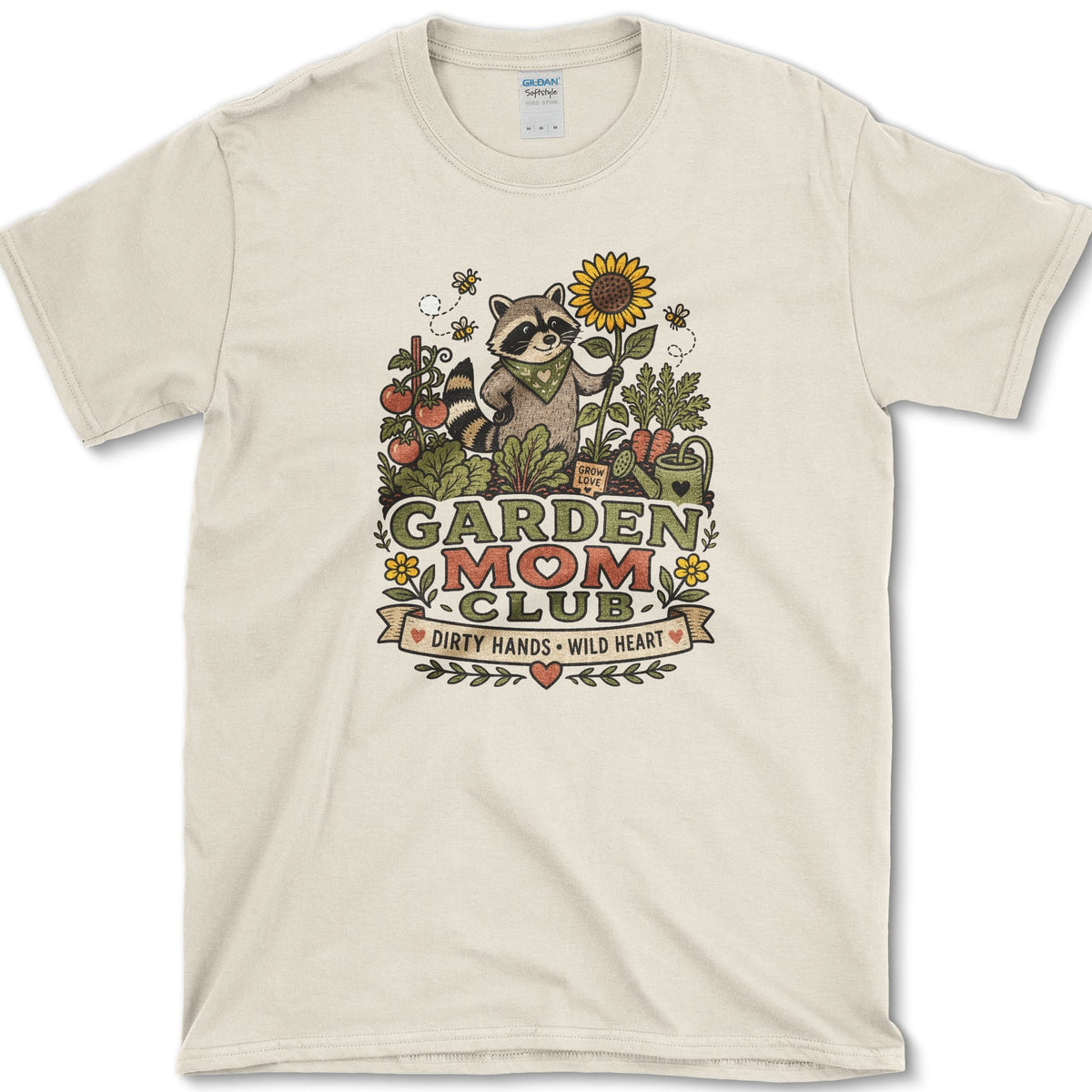 Raccoon wearing a bandana and holding a sunflower and trowel among tomatoes, bees, and Garden Mom Club lettering