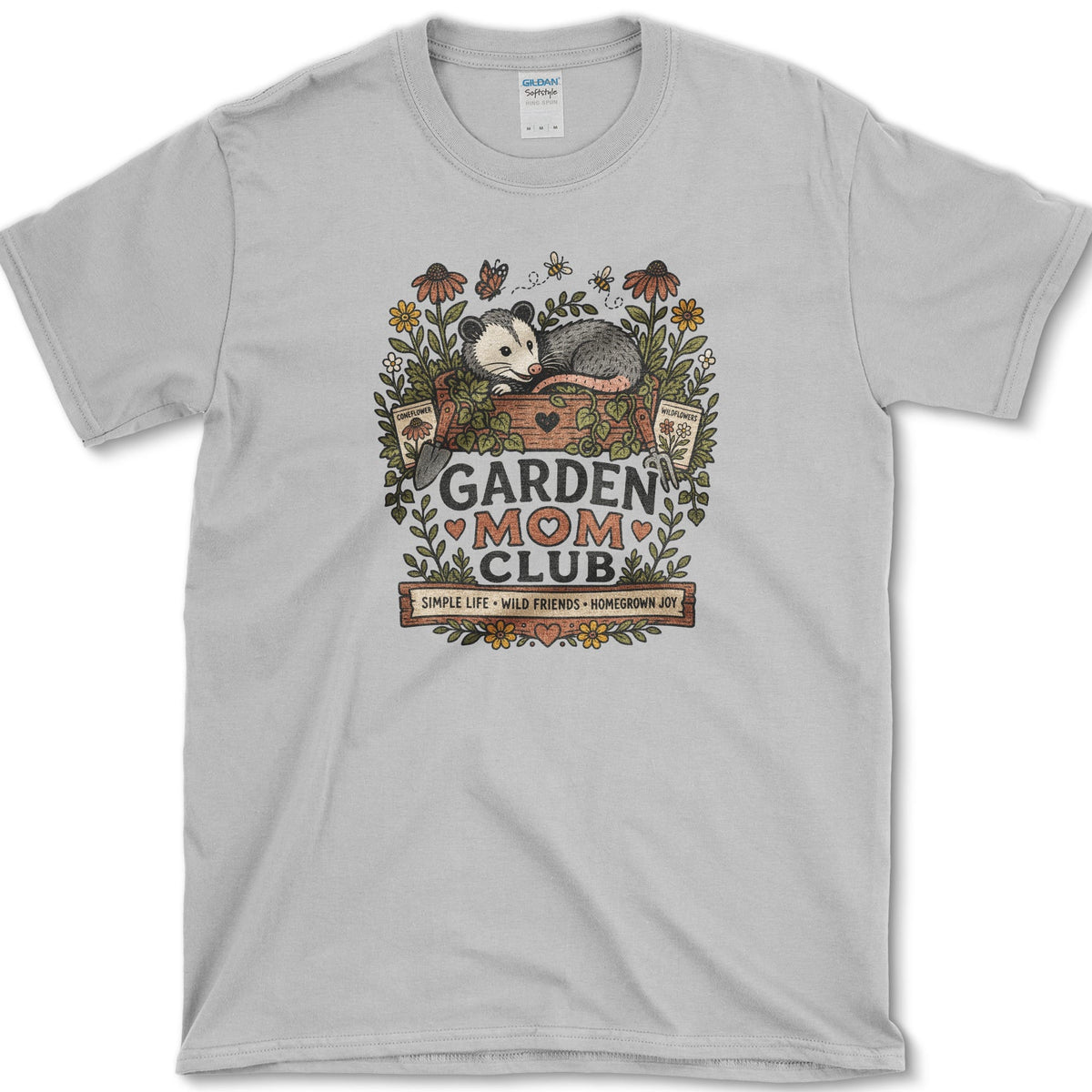 Opossum resting in a painted garden planter surrounded by coneflowers, bees, butterflies, and Garden Mom Club lettering