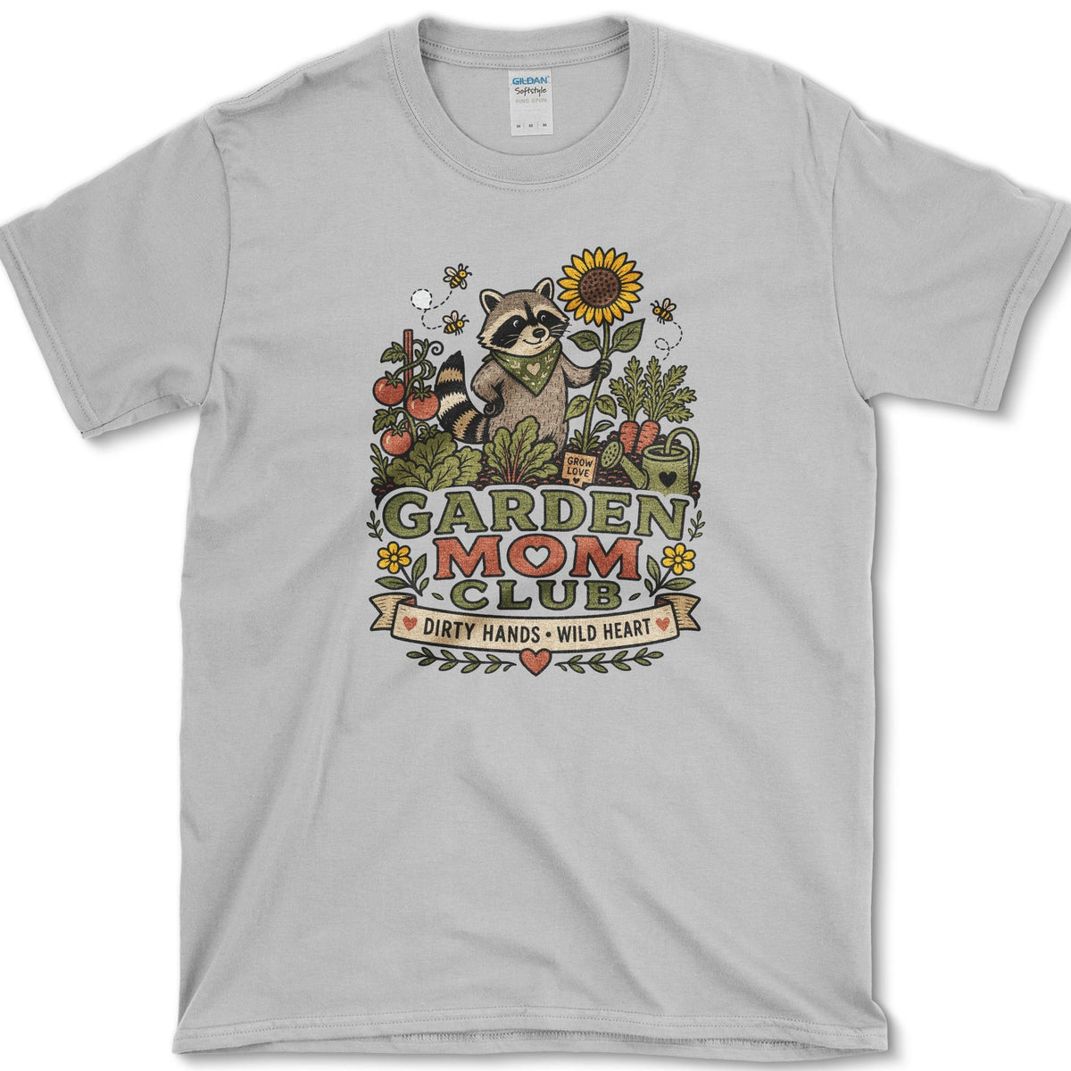Raccoon wearing a bandana and holding a sunflower and trowel among tomatoes, bees, and Garden Mom Club lettering