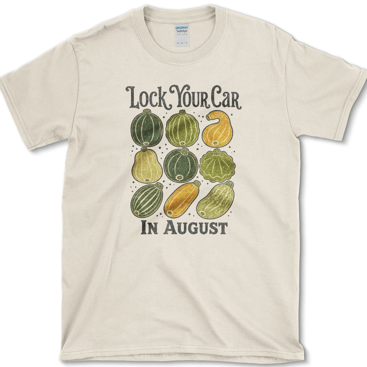 Nine colorful summer squash beneath Lock Your Car in August lettering on a T-shirt