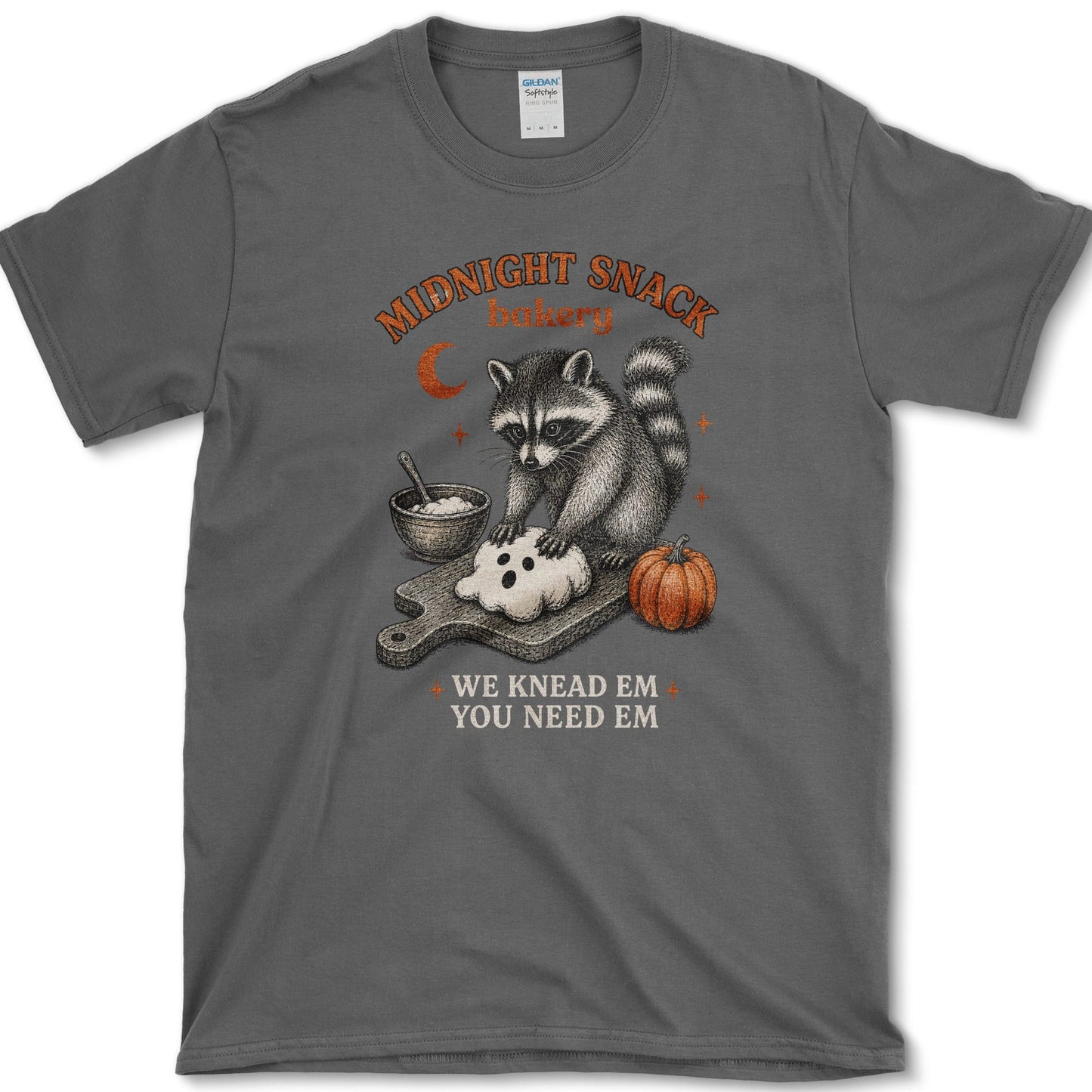 Midnight Snack Bakery artwork featuring baking raccoon and raccoon and pumpkin on a t-shirt