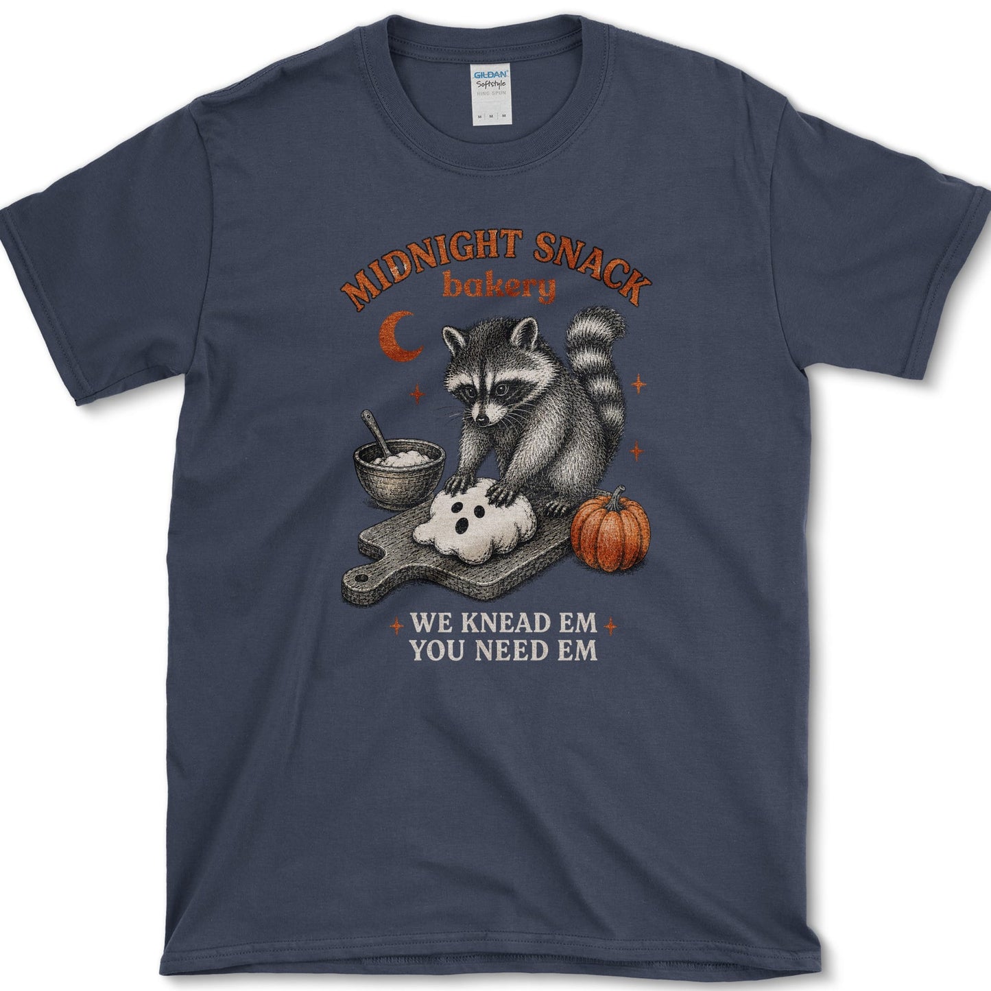 Midnight Snack Bakery artwork featuring baking raccoon and raccoon and pumpkin on a t-shirt
