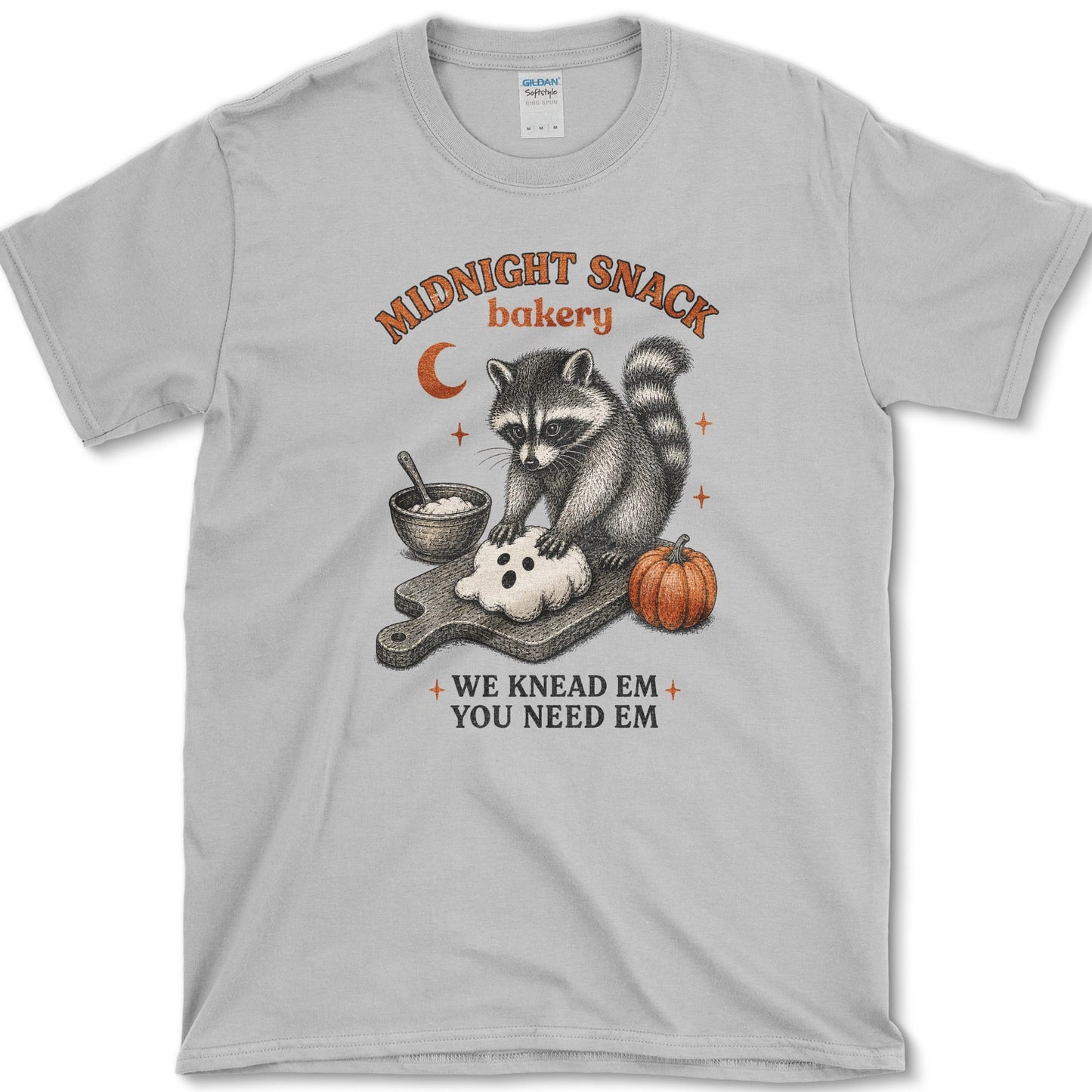 Midnight Snack Bakery artwork featuring baking raccoon and raccoon and pumpkin on a t-shirt