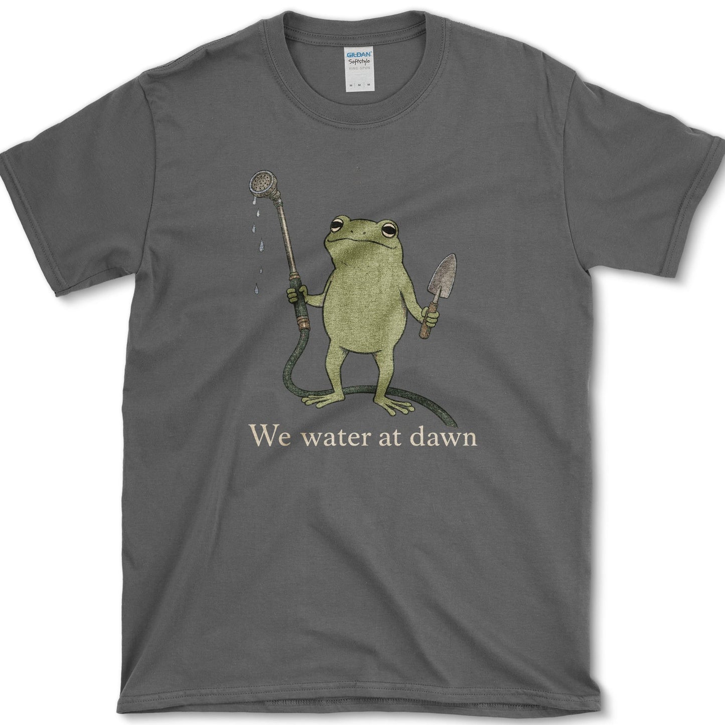 Water At Dawn artwork featuring frog and watering can on a t-shirt
