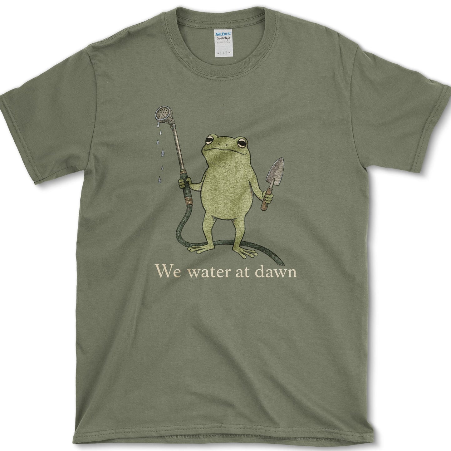 Water At Dawn artwork featuring frog and watering can on a t-shirt