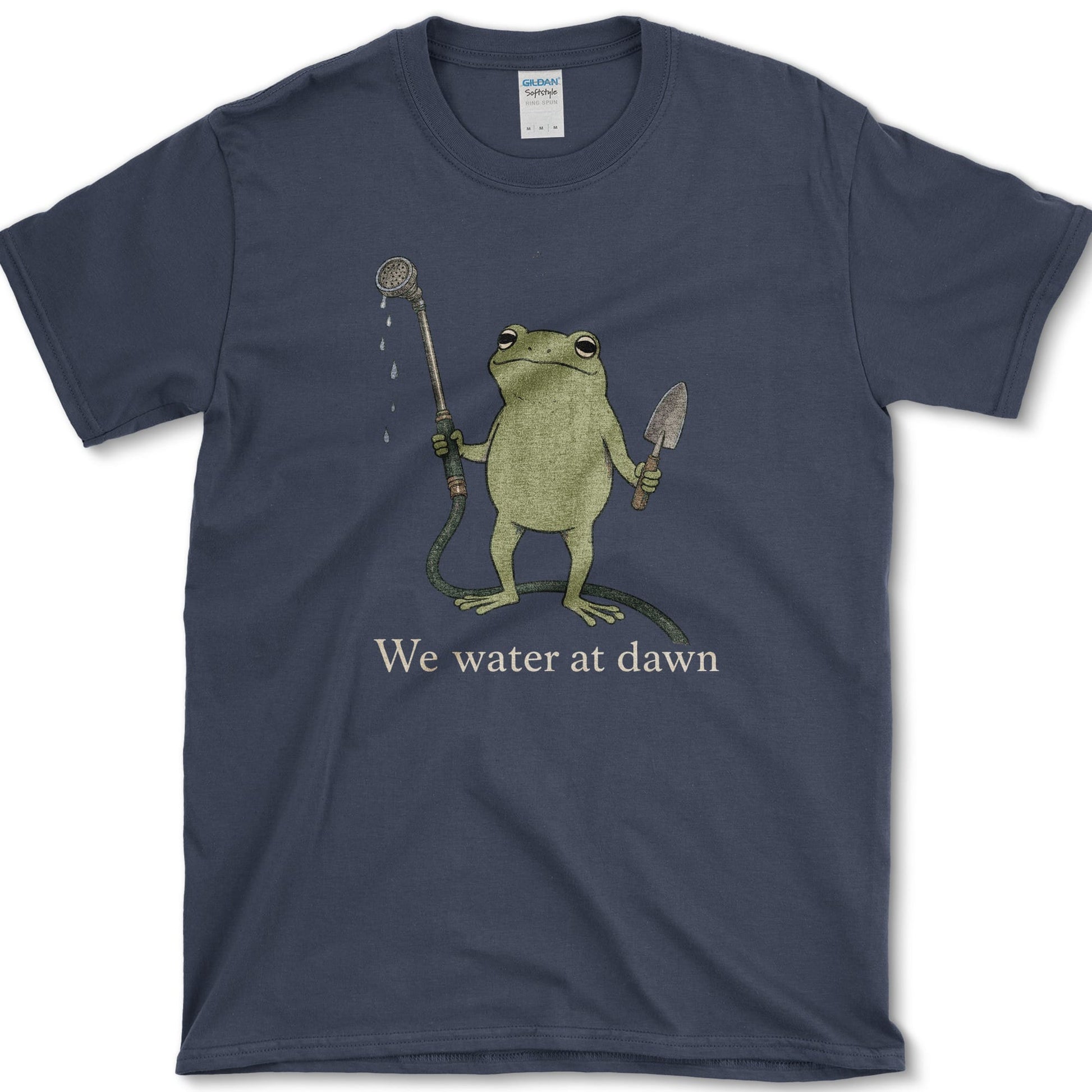 Water At Dawn artwork featuring frog and watering can on a t-shirt