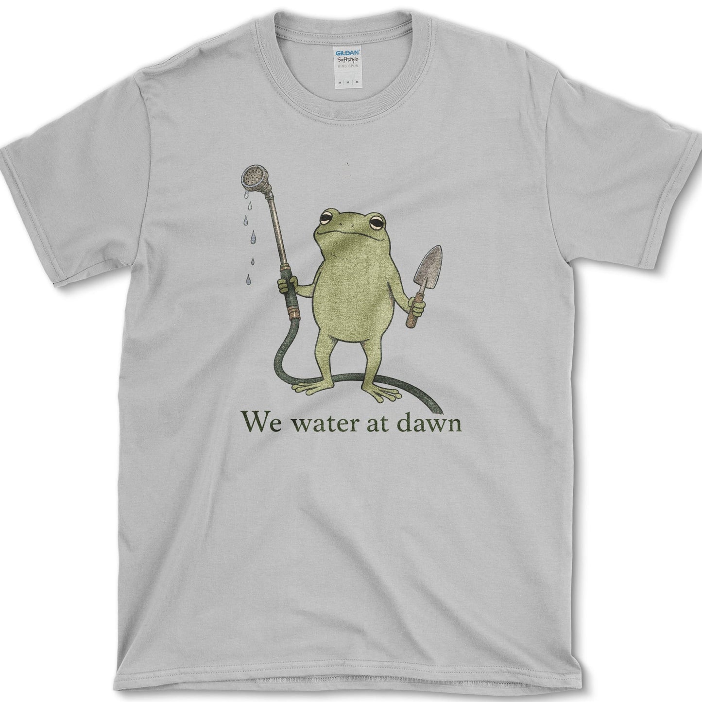 Water At Dawn artwork featuring frog and watering can on a t-shirt